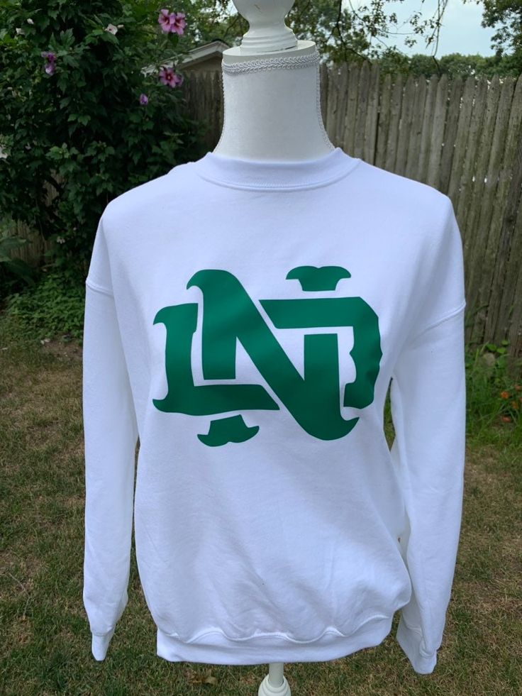 Vintage Notre Dame Crewneck!! Perfect for any Fighting Irish student, family member or fan!  Design can also be put onto a t-shirt or hoodie! Message me for other customization options, I am always happy to help! Pre-shrunk Crew Neck Sweatshirt For School Spirit, Cotton Sweatshirt For Fan Merchandise, Cotton Fan Apparel Sweatshirt, Collegiate Cotton Sweatshirt With Screen Print, Fan Gear Sweatshirt With Logo Print, University Logo Cotton Sweatshirt For Fan Gear, University Logo Cotton Sweatshirt For Fans, University Logo Cotton Sweatshirt Fan Gear, Fan Apparel Sweatshirt With Logo Print