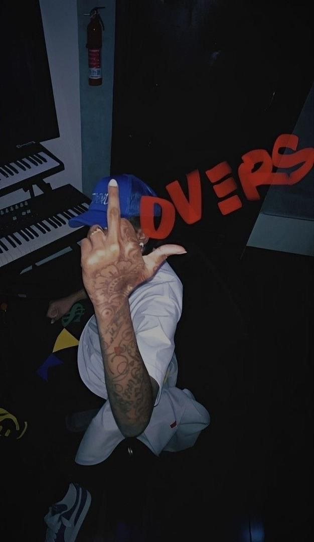 a person with their hand up in front of a keyboard and the word doves written on it