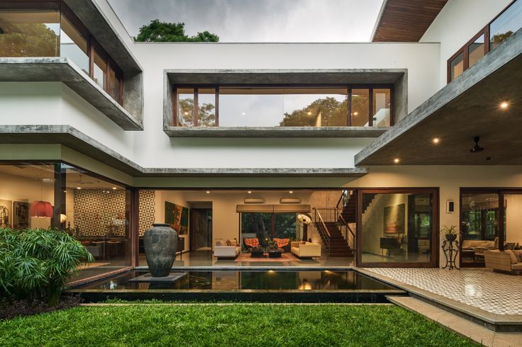 a modern house with an outdoor pool in the yard