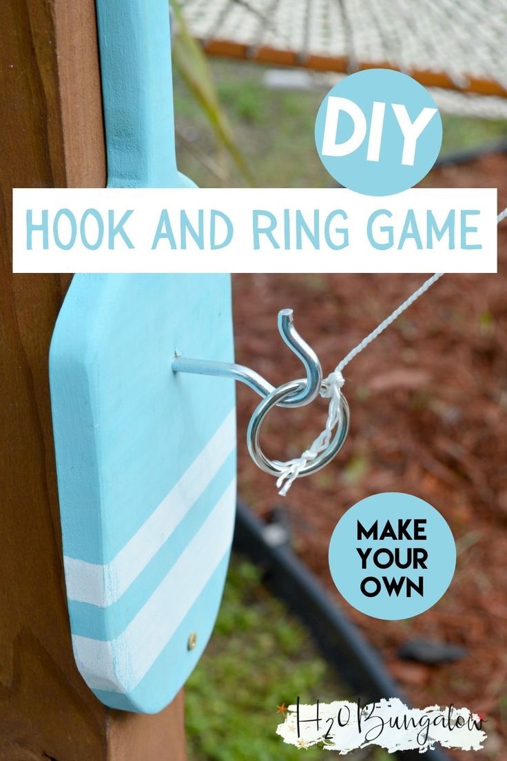 a blue and white door with the words hook and ring game hanging from it's side