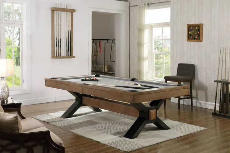 a pool table in the middle of a living room