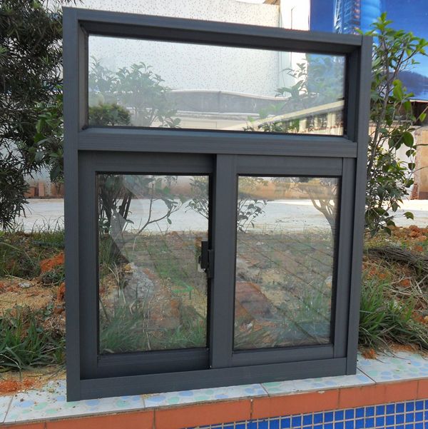 an open window on the side of a building next to a swimming pool and trees