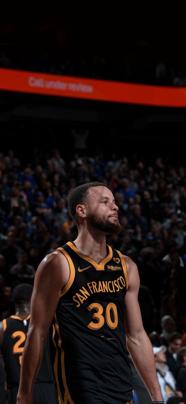 a basketball player is looking up at the sky