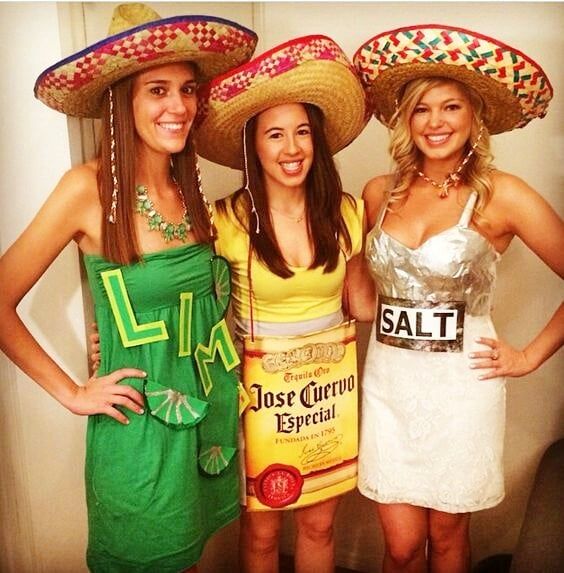 three women wearing sombreros posing for the camera