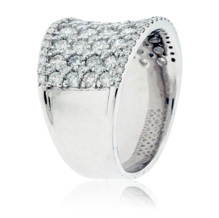 a white gold ring with diamonds on the outside and inside, set in 18k white gold