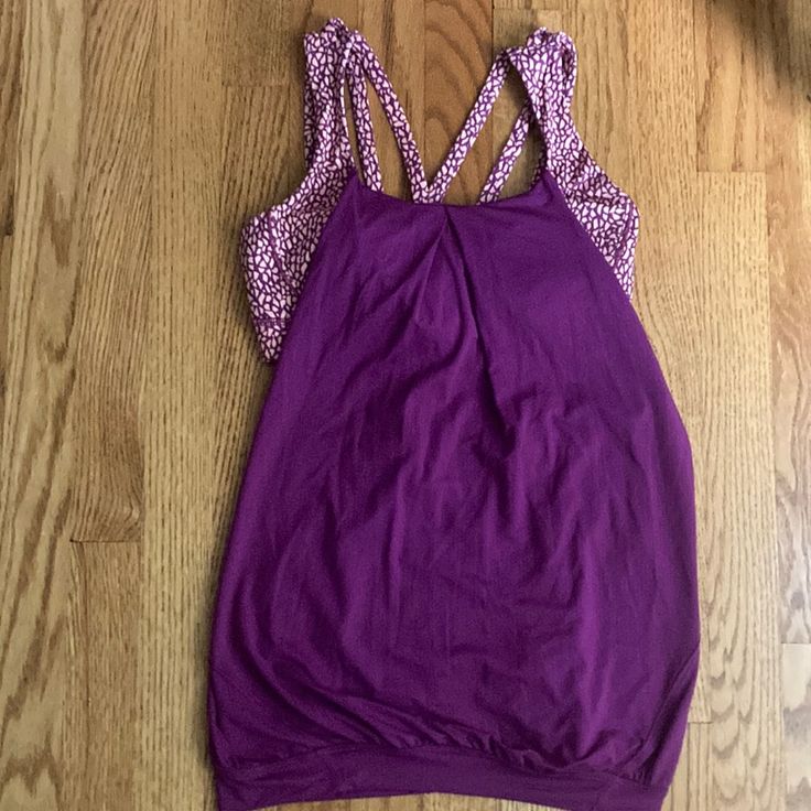 Very Unique Design That Includes The Sports Bra It Is A Maroon Color With A Maroon And Tan Design In A Sports Bra Top. New Never Worn There Is Not A Size On It But I Believe It’s A 4/6 Purple Activewear With Built-in Bra For Light Exercise, Casual Purple Tank Top For Sports, Cotton Activewear With Built-in Bra For Workout, Purple Racerback Top For Gym, Purple Stretch Racerback Top, Purple Stretch Tank Top For Workout, Purple Sporty Yoga Tops, Purple Sleeveless Top For Light Exercise, Sporty Purple Yoga Tops