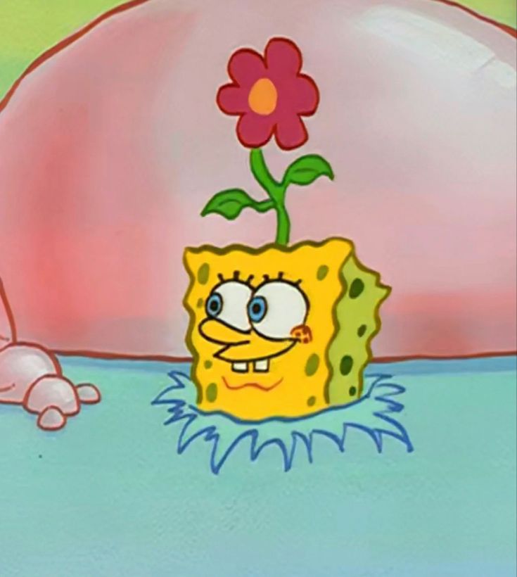 the spongebob is holding a flower in his hand