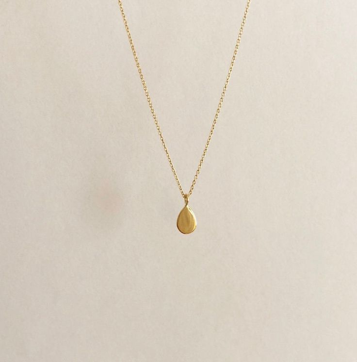 FREE SHIPPING, 14k yellow solid gold drop necklace. It can be produce 14k rose gold and white gold. DETAILS Chain is shown length approx. 40 cm (16 inch) and thickness is 1mm (0.04 inch). Pendant height is 0.6 cm (0.23 inch). Chain can be lengthened for choosing option. The chain has a spring ring clasp. You may order a shorter or longer chain by leaving a note during checkout. MATERIALS All our jewelry are made of 14 karats solid gold. We like to use yellow gold, white gold and rose gold to ple Dainty Yellow Gold Teardrop Jewelry, Dainty Teardrop Yellow Gold Jewelry, Minimalist 14k Gold Teardrop Pendant Jewelry, Minimalist 14k Gold Teardrop Jewelry, Minimalist Yellow Gold Teardrop Pendant Jewelry, Dainty Polished Recycled Gold Necklace, Dainty Recycled Gold Necklace With Polished Finish, Dainty Necklace In Polished Recycled Gold, Minimalist Yellow Gold Briolette Jewelry