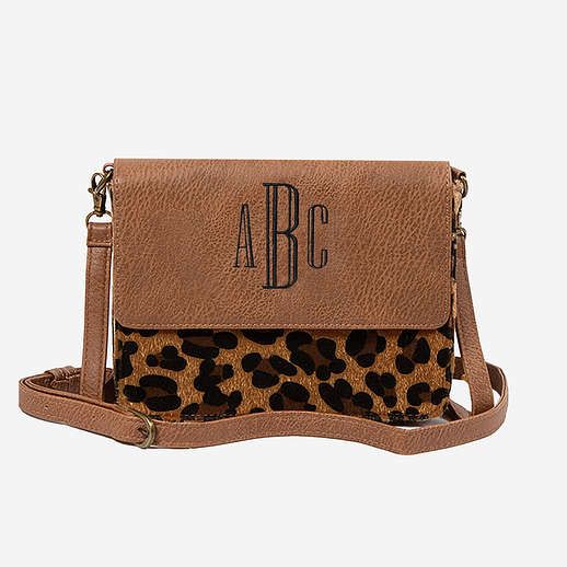 This Monogrammed Crossbody Bag will be perfect for all of your adventures and is an everyday essential! Available in brown and leopard this bag is perfectly roomy for all of your on-the-go necessities! This bag includes a crossbody strap making it easy to carry and throw over your shoulder! Love the detachable shoulder strap? Check out our Crossbody Straps to personalized your bag even more!Made of Faux Leather and Faux Calf Hair with Polyester liningMeasure approximately 8.5" Wide, 6" Tall and Leopard Print Travel Bag For Fall, Leopard Print Travel Satchel Shoulder Bag, Leopard Print Travel Pouch Bag, Travel Leopard Print Satchel Shoulder Bag, Everyday Leopard Print Bags With Adjustable Strap, Everyday Leopard Print Bag With Adjustable Strap, Travel Satchel With Adjustable Strap In Leopard Print, Leopard Print Crossbody Shoulder Bag With Adjustable Strap, Leopard Print Crossbody Satchel With Detachable Strap