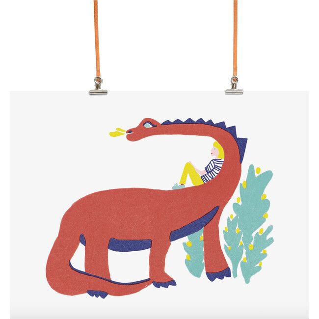 a red dinosaur is hanging on the wall