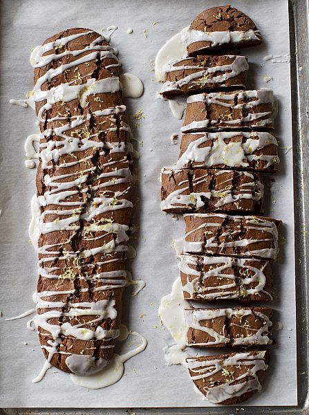 some kind of bread with icing on top of a baking sheet in a pan