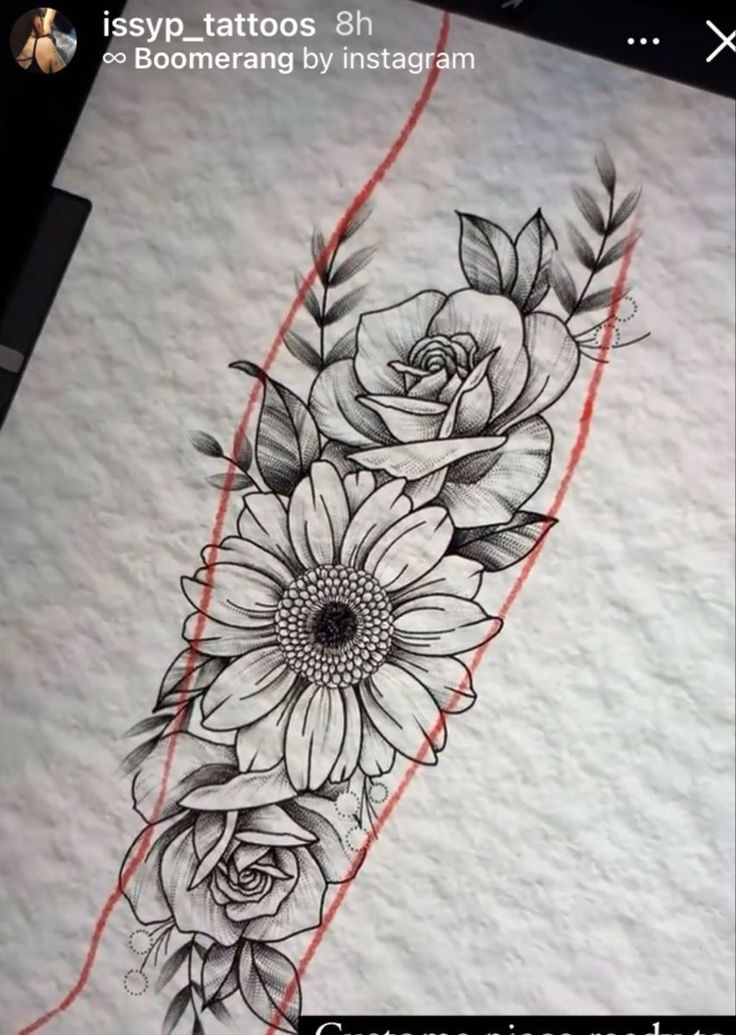 a tattoo with flowers and leaves on it