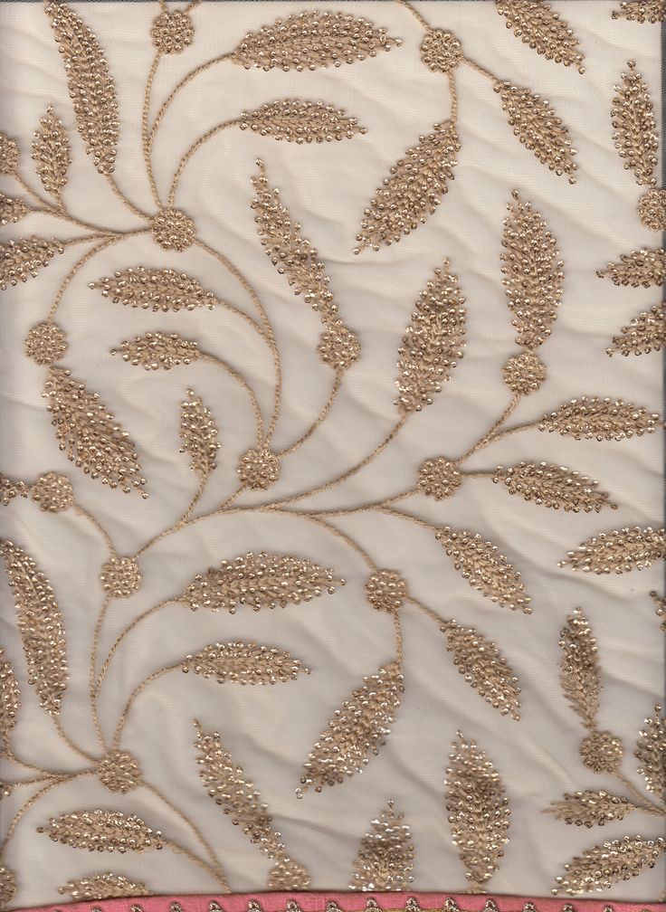 an embroidered fabric with gold threadwork on it