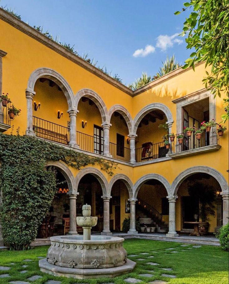 the courtyard of an old spanish style house