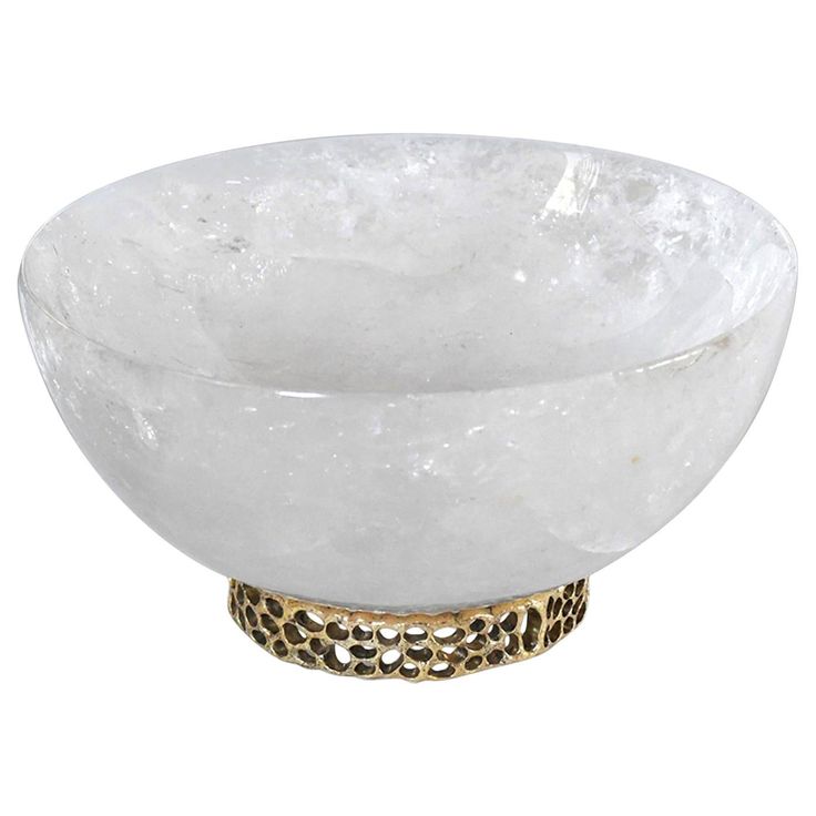 a white bowl with gold accents on the rim