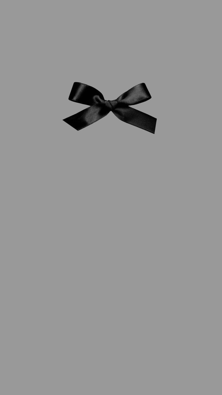 a black bow on a gray background