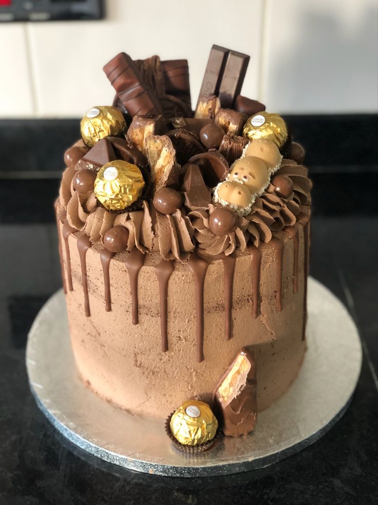 a chocolate cake with lots of candy on top