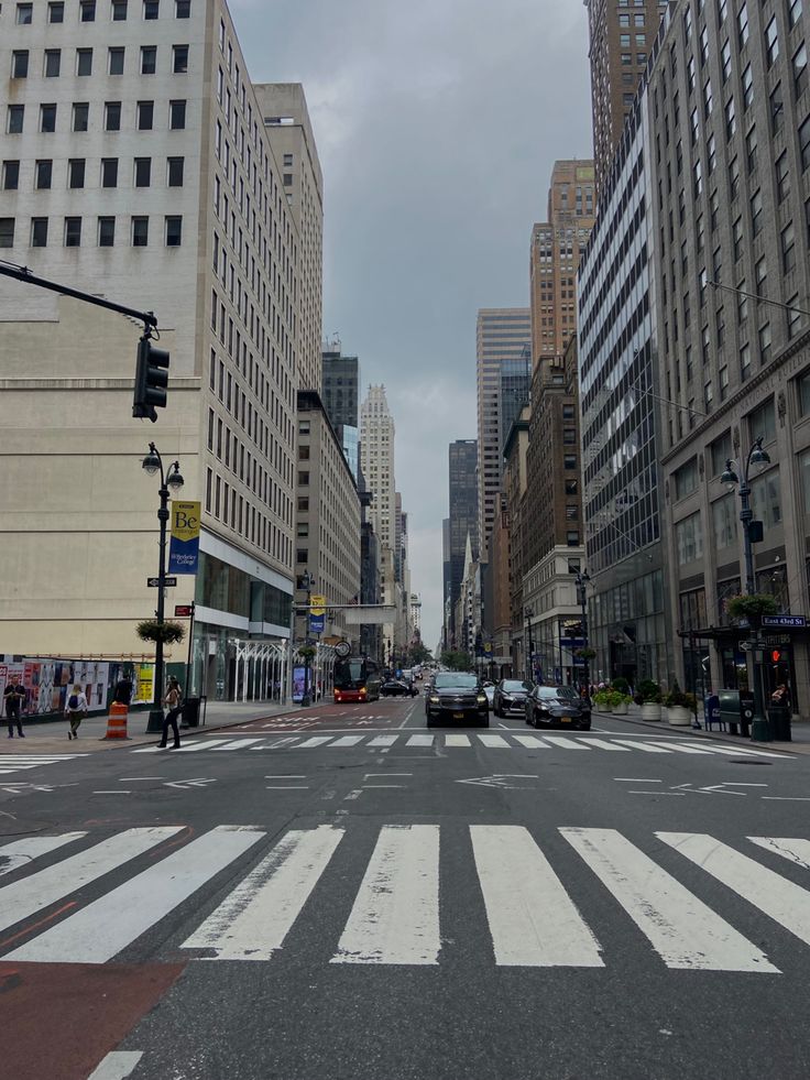 a city street with tall buildings on both sides