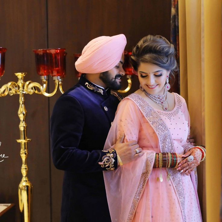 a bride and groom standing next to each other