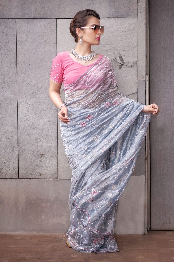 Grey saree highlighted with pearl-sequin embroidery. Comes with blouse.
Component: 2
Embroidered
Sleeve Type: Half
Fabric: Tissue
Color: Grey, Pink - Aza Fashions Grey Saree, Embroidered Saree, Sequin Embroidery, Blouse For Women, Sequins Embroidery, Fashion App, Saree With Blouse, Blouse Online, Sarees Online