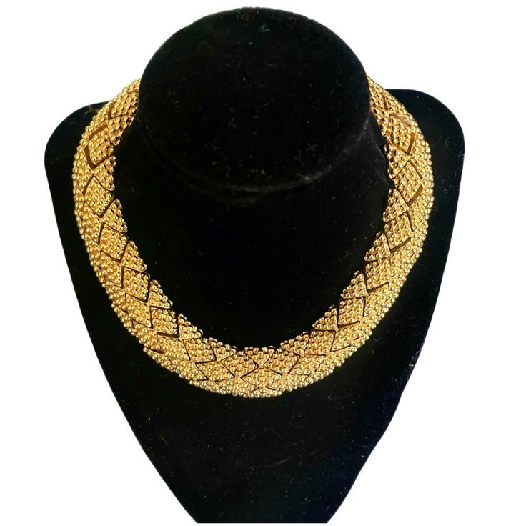 Ciner necklace composed of intricate links of beaded diamond shaped gold toned metal. Linked pieces are about an inch wide. Sophisticated and chic. Single clasp, not adjustable and best fits a smaller neck. Necklace drop is about 5 inches. Circa 1980s. Gold Beaded Necklaces For Evening, Gold Beaded Necklaces For Evening Costume Jewelry, Gold Necklace With Gold Beads For Evening, Gold Beaded Necklace For Evening In Costume Jewelry Style, Formal Gold Chain Necklace With Beads, Gold Beaded Necklace Costume Jewelry For Evening, Gold Costume Jewelry Beaded Necklace For Evening, Gold Beaded Bridal Necklace In Costume Jewelry Style, Gold Costume Jewelry Choker For Evening