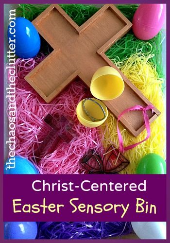 an easter cross surrounded by eggs and other colorful items with the words christ - centered easter sensory bin