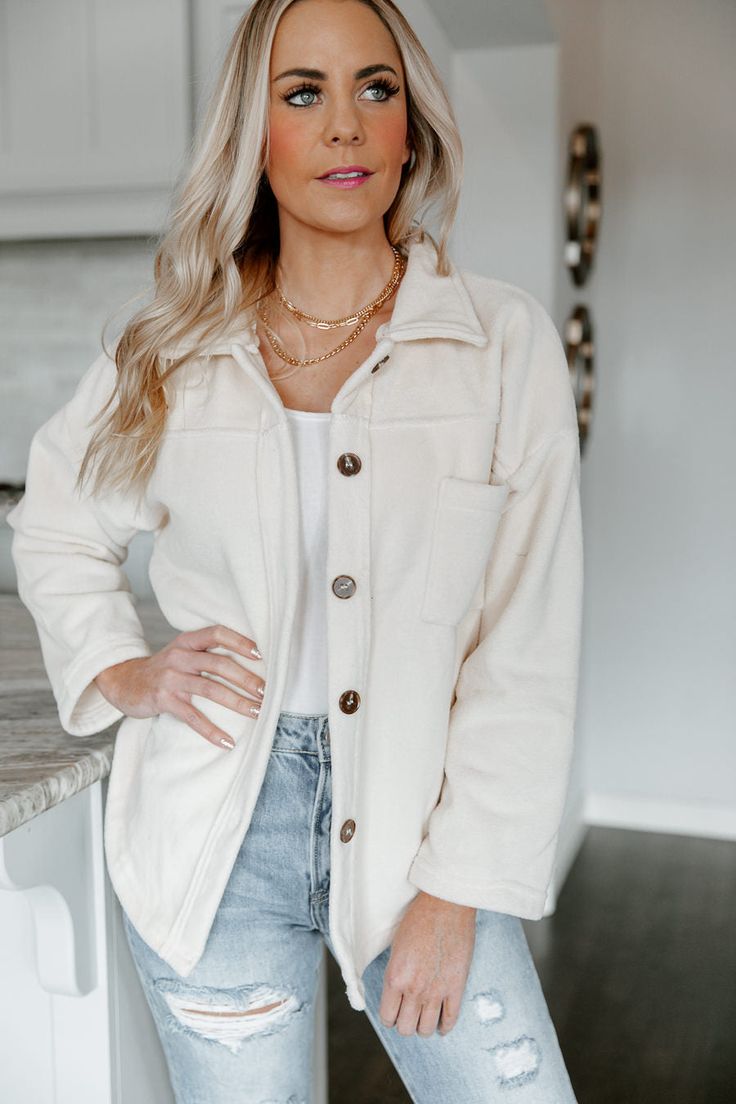 Invite this timeless layering piece into your wardrobe in our "Strike A Cord" button down shirt jacket. This cream shacket is secured with front button closures. Designed with bust pockets and button cuffs. Styled with the " Taryn" high rise mom jeans for a sleek effortless look. PRODUCT DETAILS: Front Button Closures Not Lined Colors May Vary Patterns May Vary CONTENT + CARE: Machine Wash Cold, Tumble Dry Low SIZE + FIT: Model: Model is 5'7" and wearing a Size Medium Fit: This garment runs smal Cream Single-breasted Button-up Outerwear, Winter Utility Jacket With Button Closure For Everyday, Everyday Winter Utility Jacket With Button Closure, Chic Button-up Outerwear With Buttoned Pockets, Fall Cream Outerwear With Button Closure, Beige Relaxed Fit Button-up Shacket, Casual Cream Button-up Shacket, Beige Collared Outerwear With Button Closure, Cream Button-up Outerwear With Snap Buttons