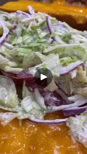 a salad with lettuce and red onions is shown in this video screen graber