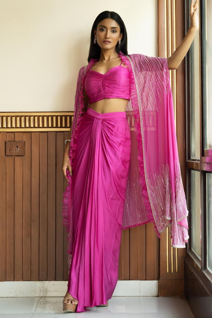 Buy Pink Georgette Embellished Crystal Cape Open Draped Skirt Set For Women by MEHAK SHARMA Online at Aza Fashions. Drape Skirt Outfit Indian, Georgette Sarees Dress Ideas, Pink Indo Western Dresses, Pink Suit Outfit Women, Trendy Indowestern Outfits For Women, Drape Skirt Outfit, Stylish Suits Women Indian, Skirt Indian Outfit, Indo Western Saree Look