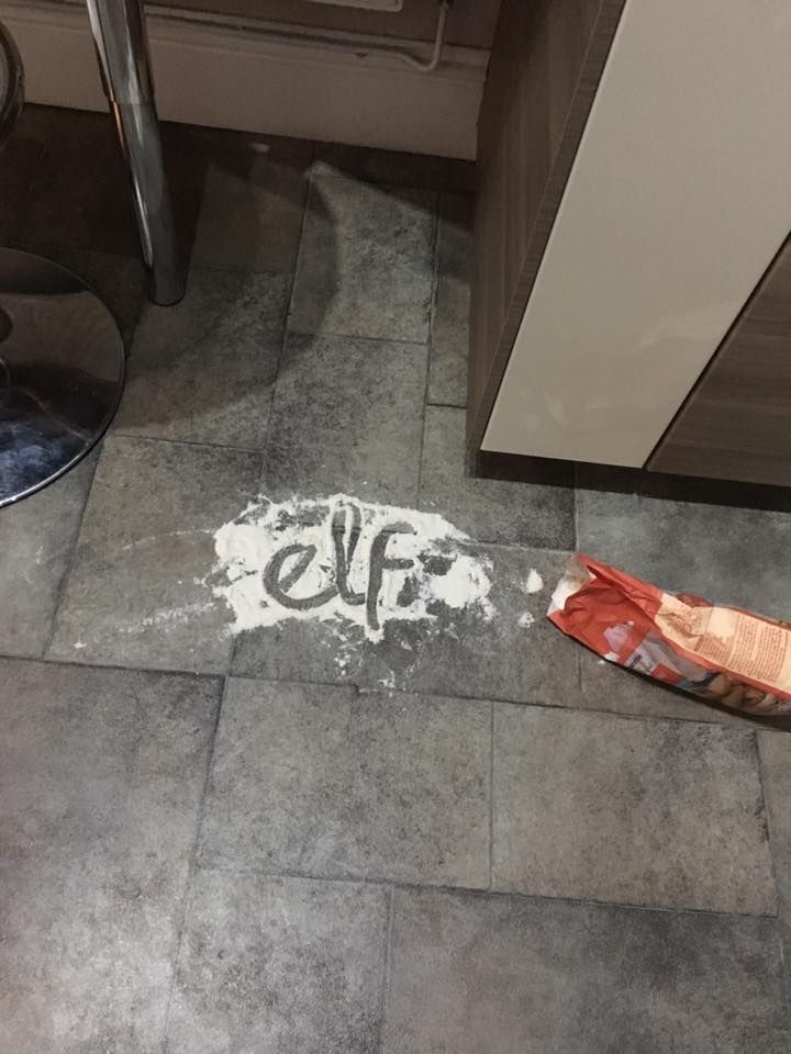 a kitchen floor with the word eff written in white on it and an orange bag next to it