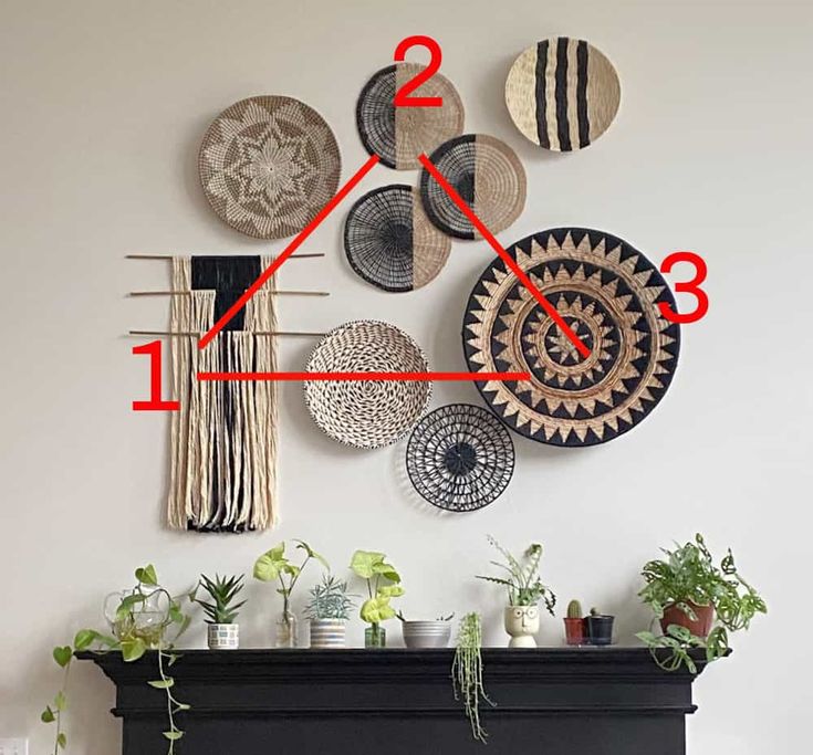 a clock that is on the side of a wall next to a fire place with plants