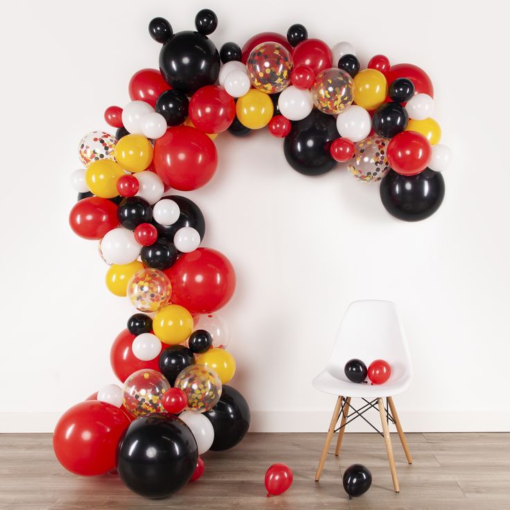 the balloon arch is decorated with black, white and red balloons