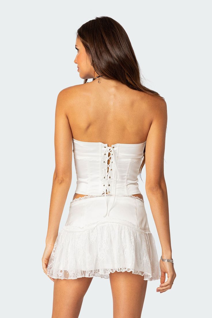 PRODUCT INFO Corset Strapless fit Sheer lace panel Back lace up closure Satin fabric Matching set Polyester, Spandex Model wears size S Model height is 5'7 Item care: Wash with similar color White Lace Corset, Fabric Matching, Lace Corset Top, White Corset, Miniskirt Outfits, Lace Set, Lace Corset, Alter Ego, Lace Panelled