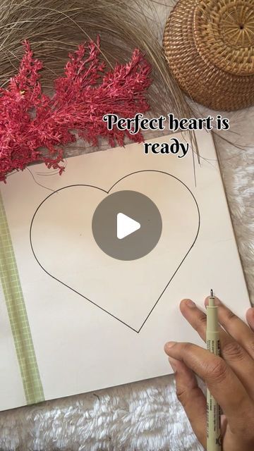 someone is drawing a heart on a piece of paper with the words perfect heart is ready