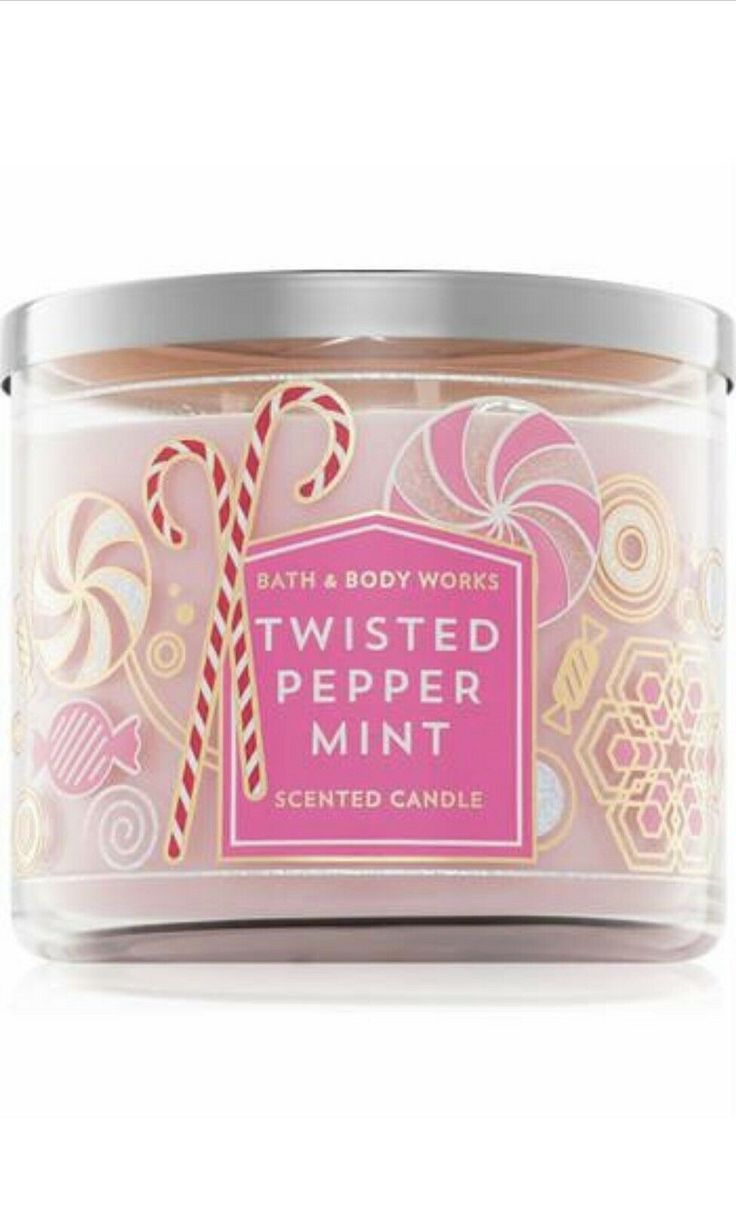 bath and body works twisted peppermint scented candle in a glass jar with candy canes