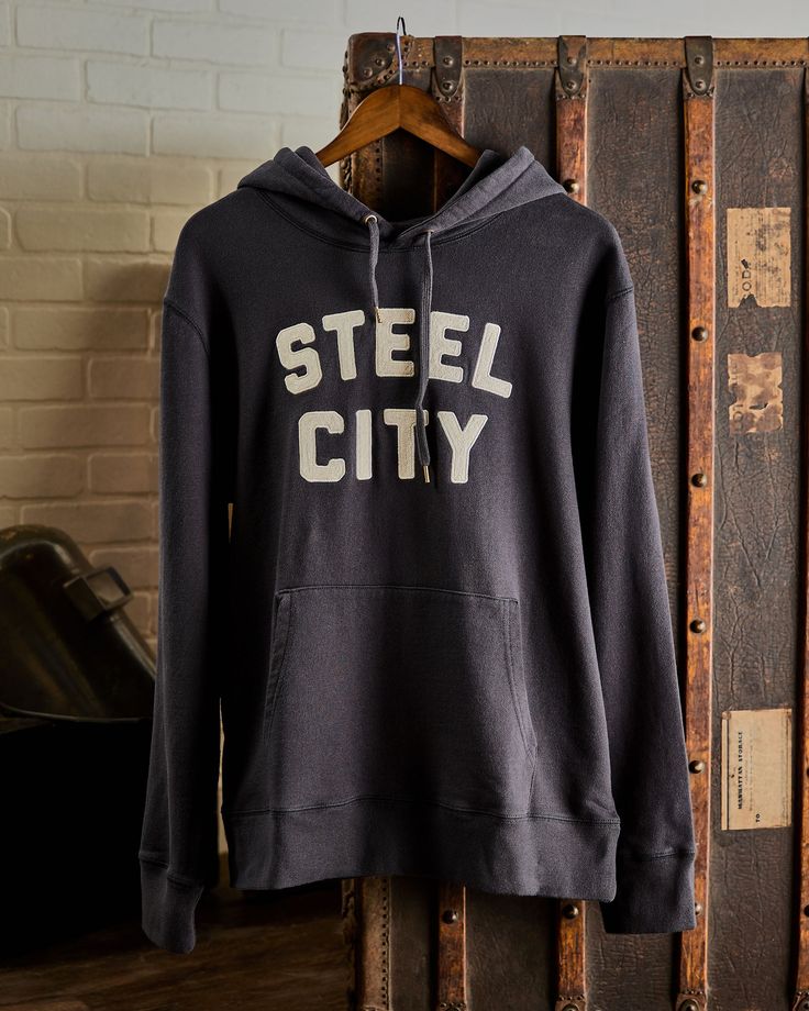 Our Vintage Stitched Logo Pullover is crafted with luxurious comfort in mind. Made from a mid-weight 400 gram 100% cotton that's pre-shrunk for the perfect fit. Garment dyed and washed for a soft finish, featuring our embroidered Steel City Logo. Model is 6’3” and 195 lbs, wearing a size large. 10 Logo, City Logo, Logo Mugs, Steel City, Strapback Hats, For Sale Sign, Shirt Shop, Trucker Hat, Pullover Hoodie