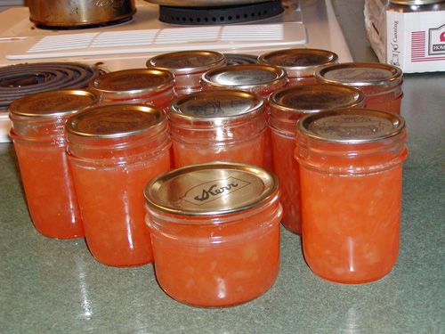 there are many jars with lids on the counter