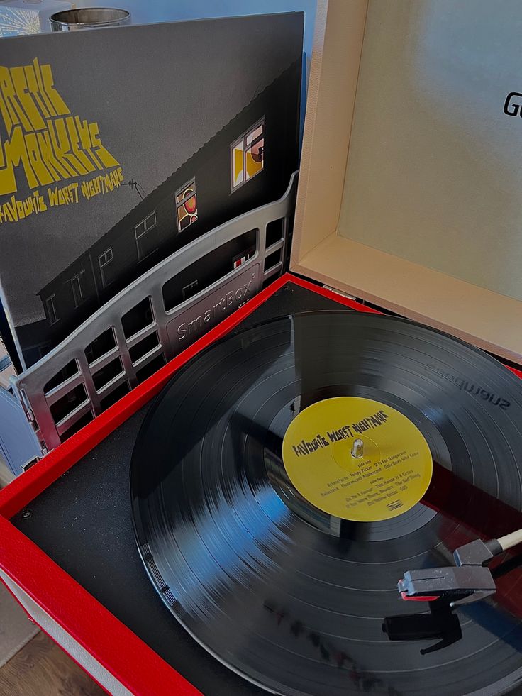 an old record player is open and ready to play the music on it's turntable