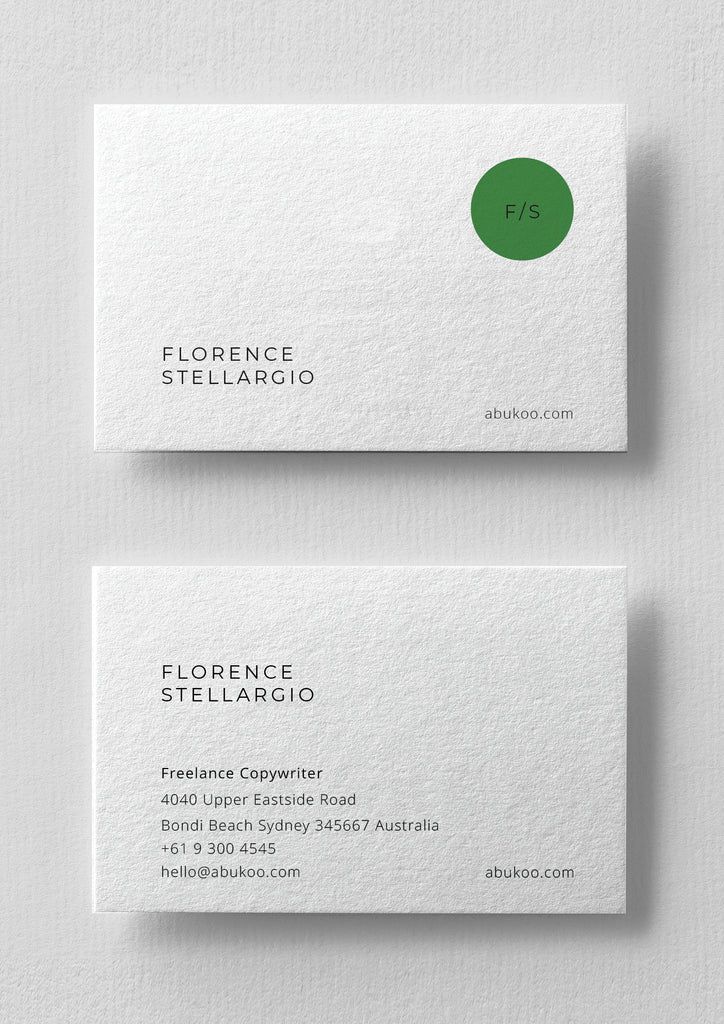 two white business cards with green circles on the front and back, both in different colors