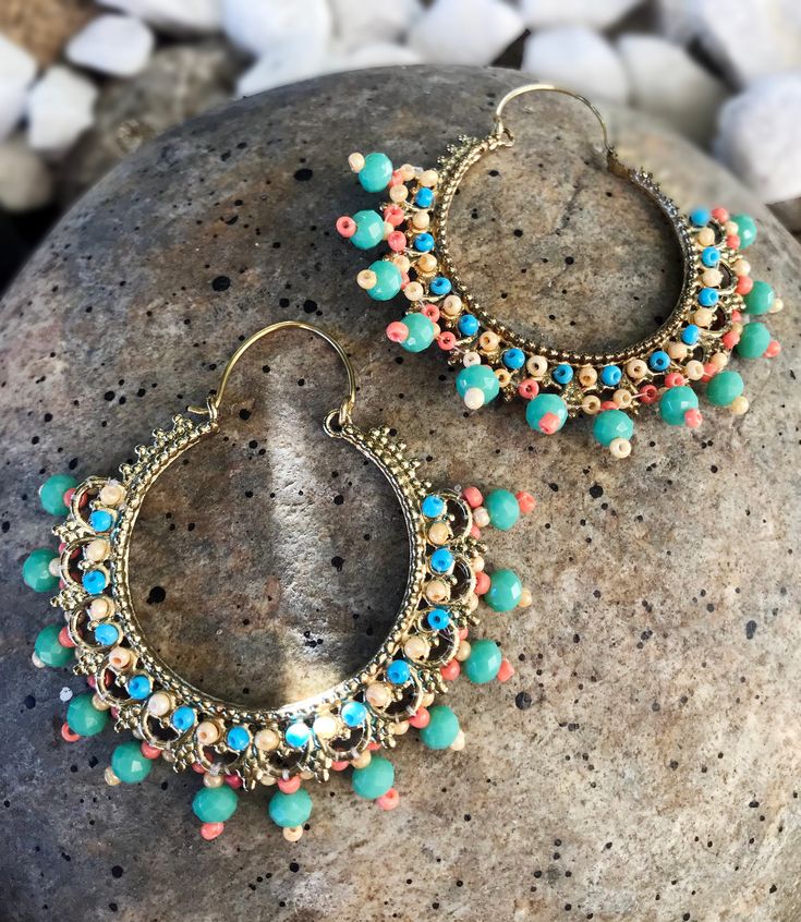 "Turquoise beaded hoop earrings A gorgeous pair of earrings These very ethnic ornate Hoop Earrings were handcrafted by Tribal Jewelry artisans. They are made of brass which is gold plated along the lines of classic tribal Yemeni styling. Yemeni artisans were among the first jewelry makers recorded in the archaeological record from this region. The influence of their timeless designs and techniques can be seen in the various jewelry traditions throughout Central Asia, even today. Well made with d Bohemian Beaded Dangling Earrings, Bohemian Beaded Dangle Earrings, Beaded Bohemian Chandelier Earrings, Unique Beaded Hoop Jewelry, Bohemian Beaded Chandelier Earrings, Bohemian Hoop Earrings For Festive Occasion, Nickel-free Hoop Earrings For Festivals, Turquoise Dangle Jewelry For Festivals, Nickel-free Hoop Earrings For Festive Occasions