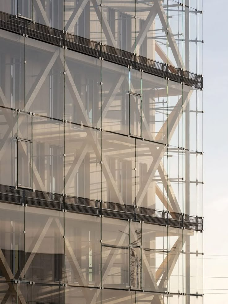 a tall building with lots of windows and scaffolding