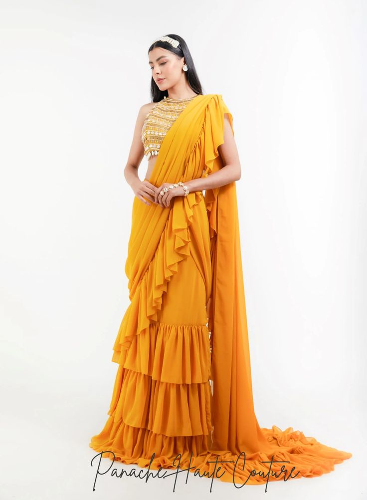 Mustard Yellow Color Ruffled Saree – Panache Haute Couture Ruffled Georgette Saree With Traditional Drape, Ruffled Georgette Saree In Traditional Drape, Traditional Yellow Ruffled Sharara, Designer Wear Saree With Ruffles In Traditional Drape, Designer Ruffled Floor-length Saree, Designer Floor-length Ruffled Saree, Traditional Georgette Lehenga With Ruffles, Bollywood Style Floor-length Saree With Ruffles, Bollywood Style Floor-length Ruffled Saree