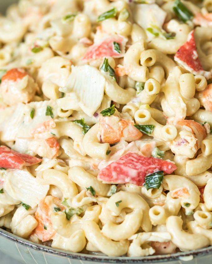 a bowl filled with pasta salad on top of a table