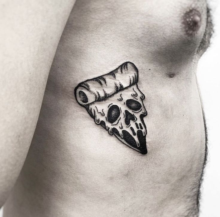 a man's stomach with a piece of pizza on it and a knife sticking out of it