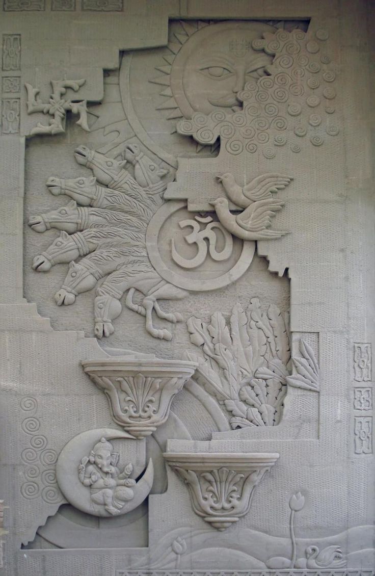 an intricately designed wall with vases and flowers on it's side, in white