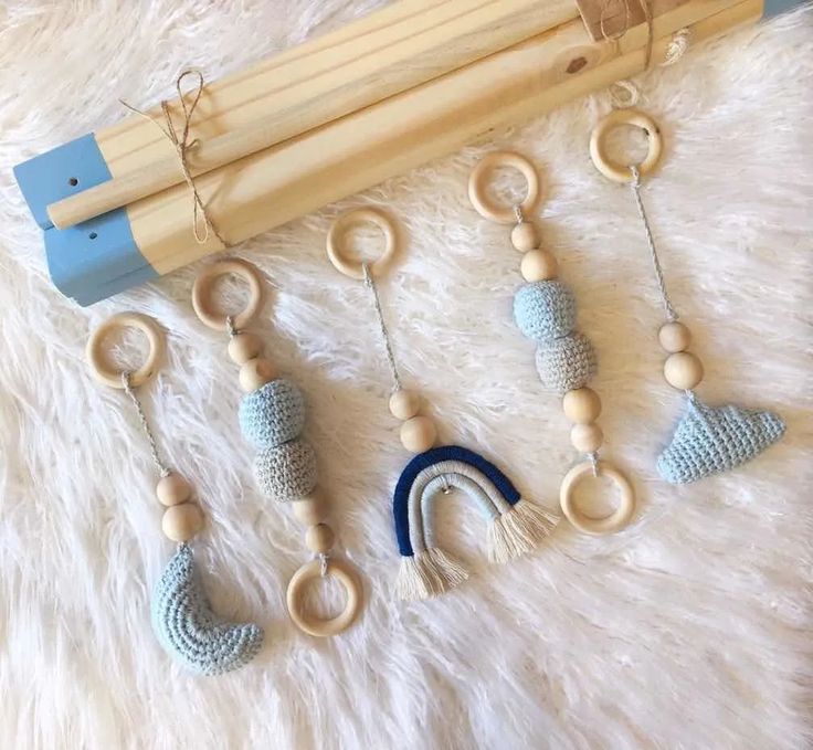 several wooden toys are laid out on a white carpet