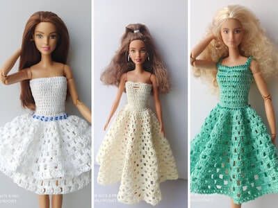 three dolls wearing dresses made out of crocheted material, one in white and the other in green