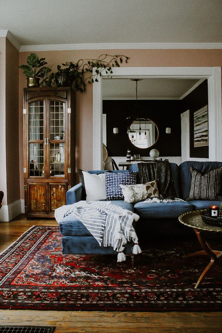 a living room filled with furniture and a rug