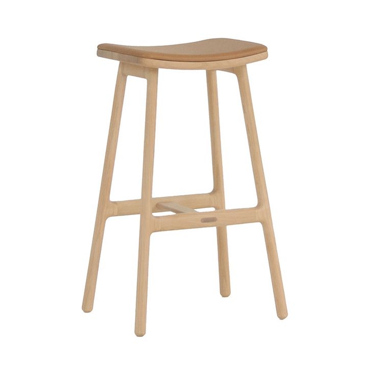 the backless stool is made from wood and has a curved seat, with a wooden frame