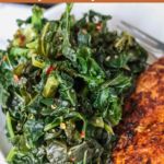 a close up of a plate of food with meat and greens on it, next to a fork